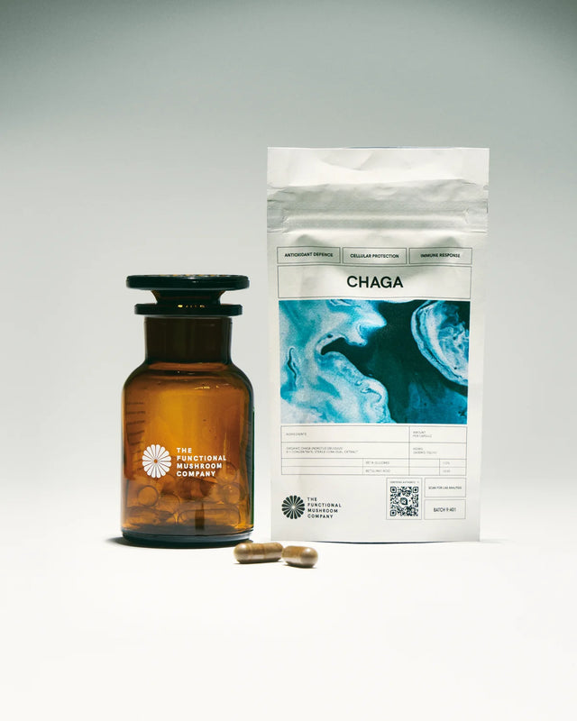 Amber bottle and white packaging labeled 'CHAGA' on a gray background